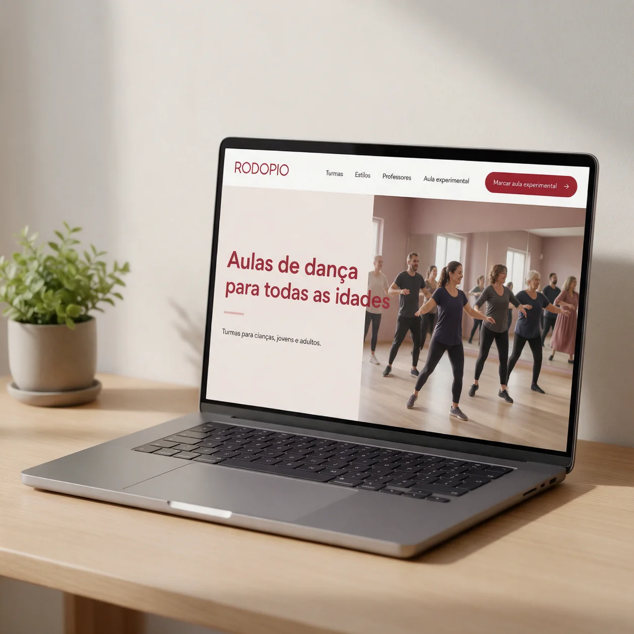 Portátil com o site de uma escola de dança