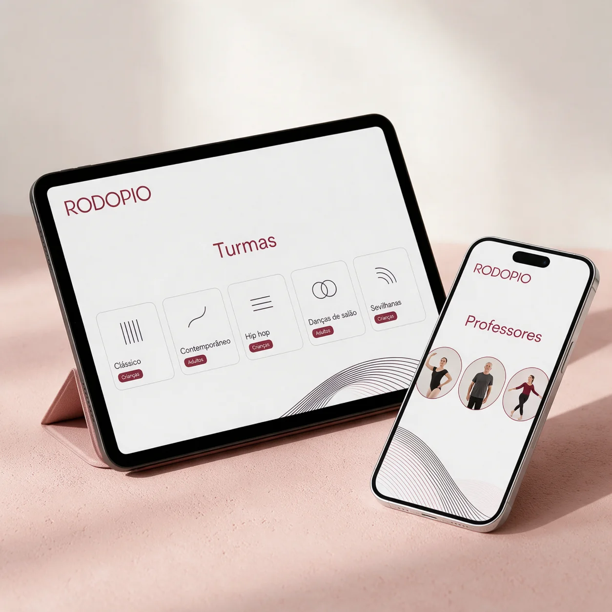 Tablet e telemóvel com as turmas por estilo e por idade de uma escola de dança