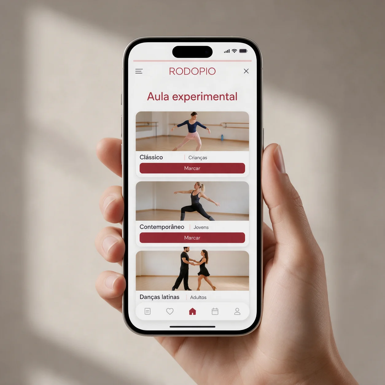 Telemóvel com a página de marcação da aula experimental de uma escola de dança